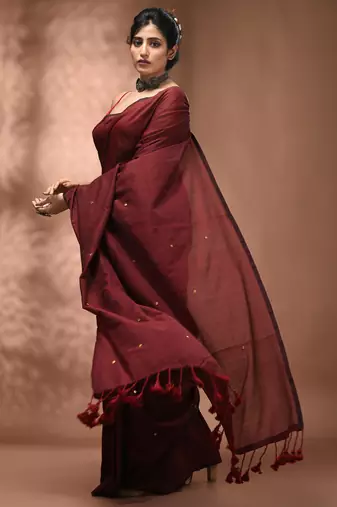 Elegant maroon cotton saree with sequin embellishments and pom pom