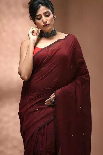 Elegant maroon cotton saree with sequin embellishments and pom pom