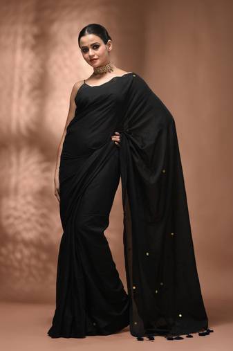 Elegant black cotton saree with sequin embellishments and pom pom
