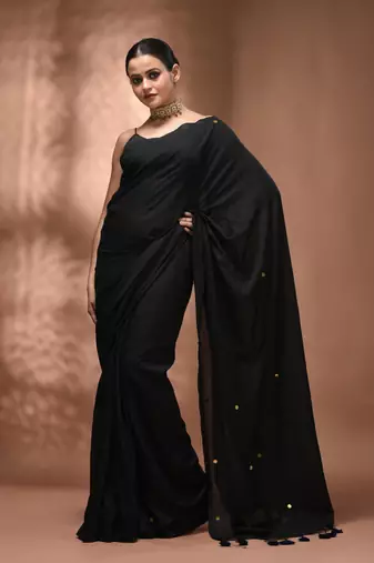 Elegant black cotton saree with sequin embellishments and pom pom
