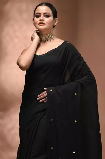 Elegant black cotton saree with sequin embellishments and pom pom