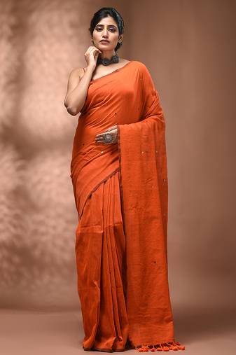 Elegant orange cotton saree with sequin embellishments and pom pom