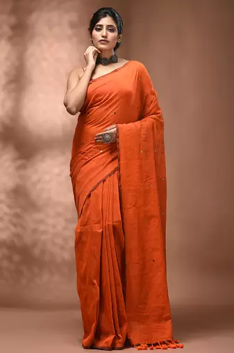 Elegant orange cotton saree with sequin embellishments and pom pom