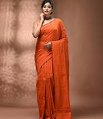 Elegant orange cotton saree with sequin embellishments and pom pom
