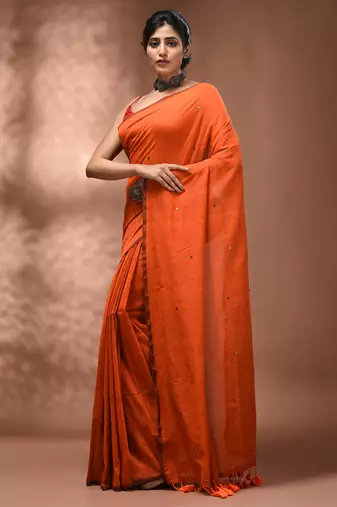 Elegant orange cotton saree with sequin embellishments and pom pom