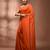 Elegant orange cotton saree with sequin embellishments and pom pom