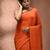 Elegant orange cotton saree with sequin embellishments and pom pom