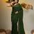 Elegant green cotton saree with sequin embellishments and pom pom