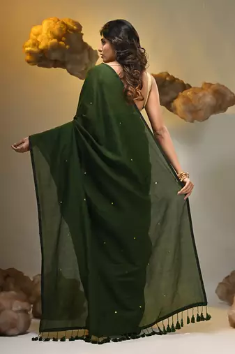 Elegant green cotton saree with sequin embellishments and pom pom