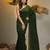 Elegant green cotton saree with sequin embellishments and pom pom