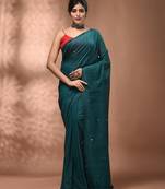 Elegant teal cotton saree with sequin embellishments and pom pom