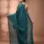 Elegant teal cotton saree with sequin embellishments and pom pom