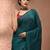 Elegant teal cotton saree with sequin embellishments and pom pom