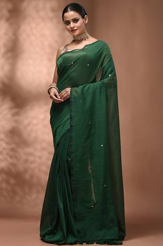 Elegant green cotton saree with sequin embellishments and pom pom