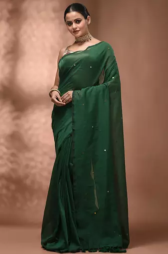 Elegant green cotton saree with sequin embellishments and pom pom
