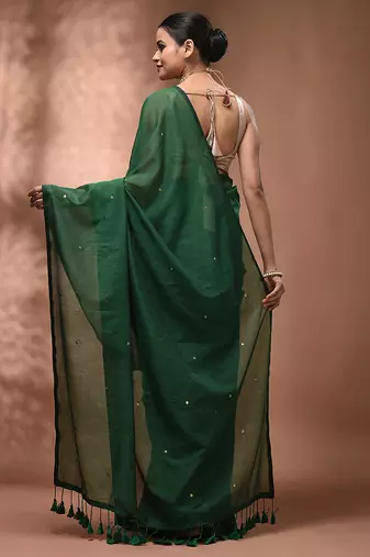 Elegant green cotton saree with sequin embellishments and pom pom