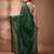 Elegant green cotton saree with sequin embellishments and pom pom