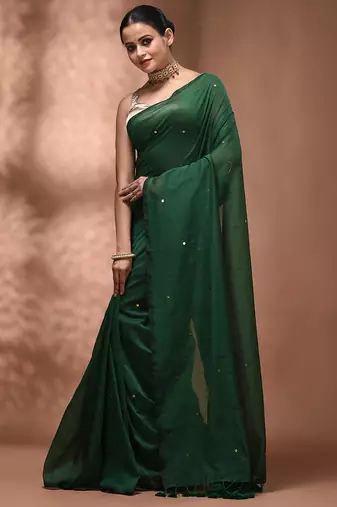 Elegant green cotton saree with sequin embellishments and pom pom
