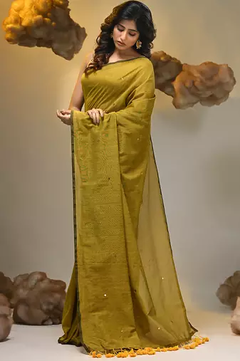 Elegant corn yellow cotton saree with sequin embellishments and pom pom