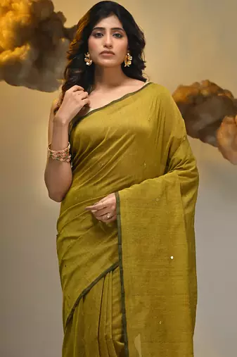 Elegant corn yellow cotton saree with sequin embellishments and pom pom