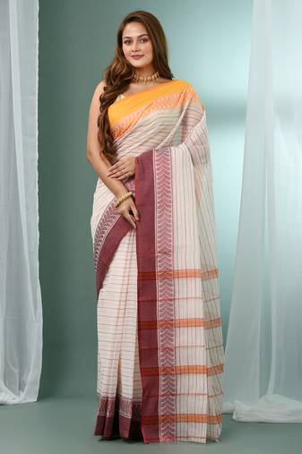 White pure cotton tant saree with woven designs