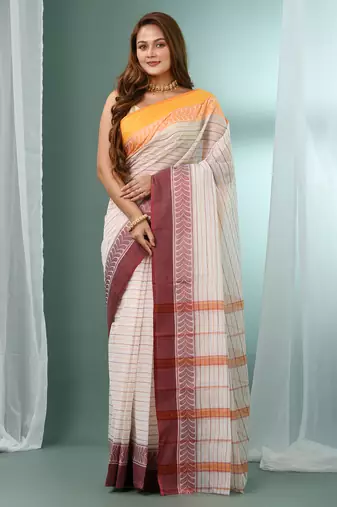 White pure cotton tant saree with woven designs