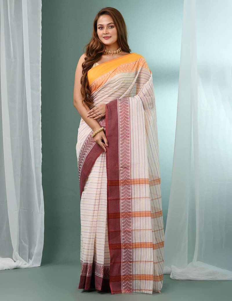 White pure cotton tant saree with woven designs
