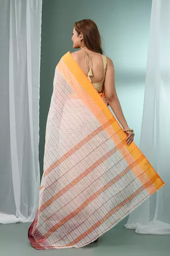 White pure cotton tant saree with woven designs