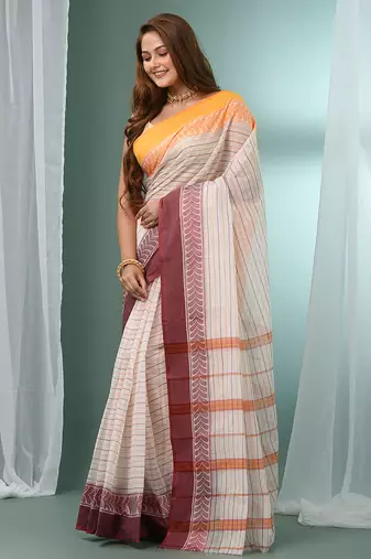White pure cotton tant saree with woven designs