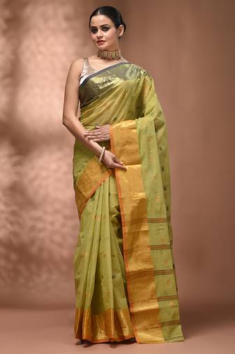 Pastel green tant pure cotton saree with contrasting zari border