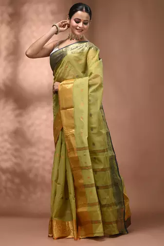 Pastel green tant pure cotton saree with contrasting zari border