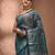 Teal tissue handwoven saree with zari woven temple borders
