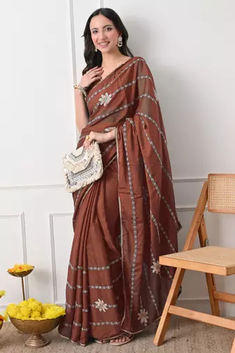 rust georgette embellished lace border saree with unstitched blouse piece