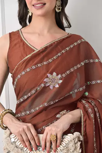 rust georgette embellished lace border saree with unstitched blouse piece