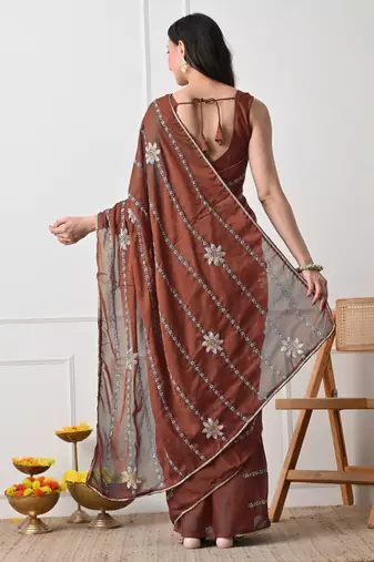 rust georgette embellished lace border saree with unstitched blouse piece