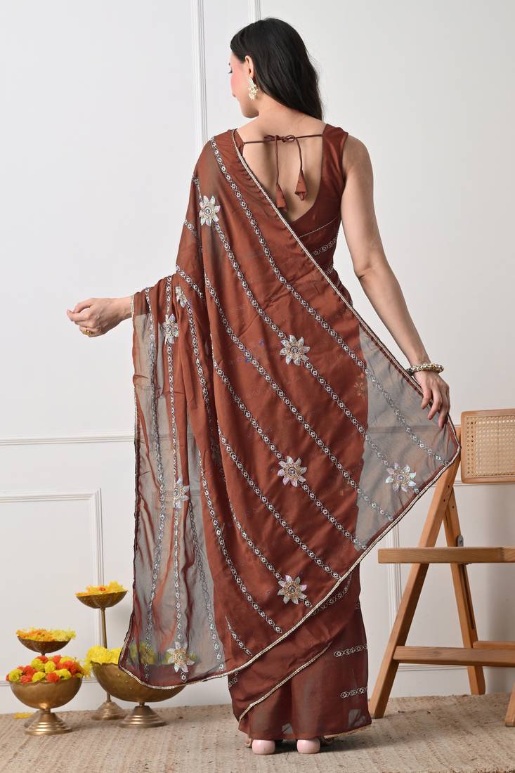 rust georgette embellished lace border saree with unstitched blouse piece