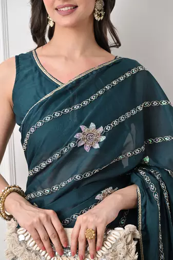 teal georgette embellished lace border saree with unstitched blouse piece
