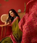 Olive silk cotton printed saree with unstitched blouse piece.