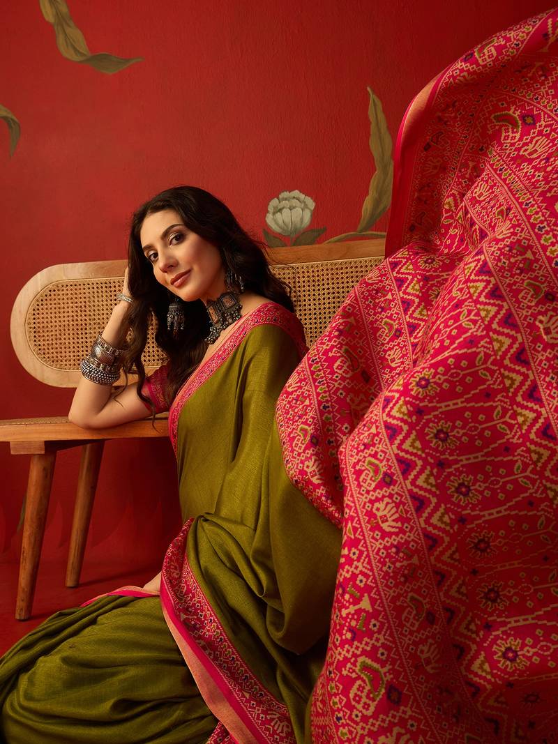 Olive silk cotton printed saree with unstitched blouse piece.