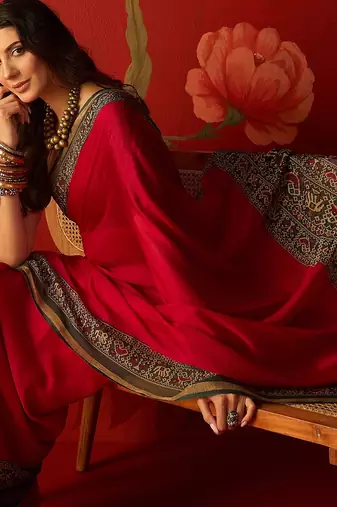 Rani silk cotton printed saree with unstitched blouse piece.