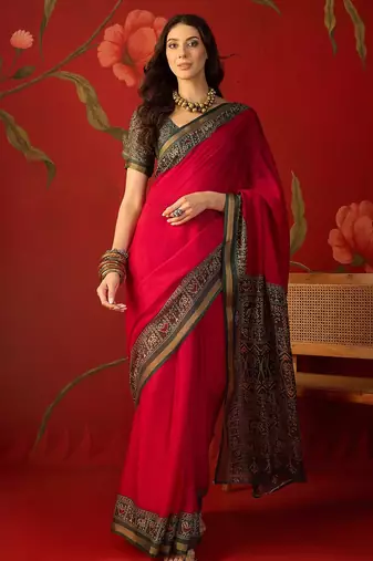 Rani silk cotton printed saree with unstitched blouse piece.