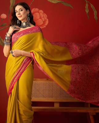 Yellow silk cotton printed saree with unstitched blouse piece. 1