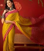 Yellow silk cotton printed saree with unstitched blouse piece.