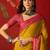 Yellow silk cotton printed saree with unstitched blouse piece.