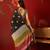 Black silk cotton bandhni printed saree with unstitched blouse piece.
