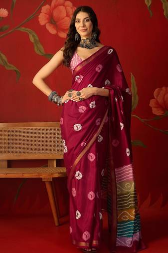 Magenta silk cotton bandhni printed saree with unstitched blouse piece.