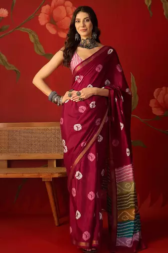 Magenta silk cotton bandhni printed saree with unstitched blouse piece.