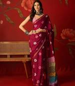 Magenta silk cotton bandhni printed saree with unstitched blouse piece.