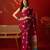 Magenta silk cotton bandhni printed saree with unstitched blouse piece.