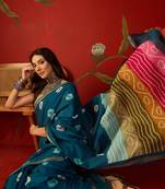 Teal silk cotton bandhni printed saree with unstitched blouse piece.